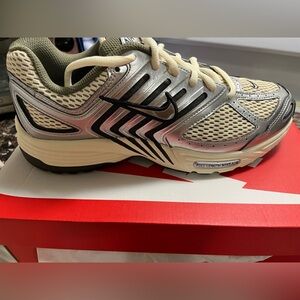 Nike Cream and Black Running Shoes